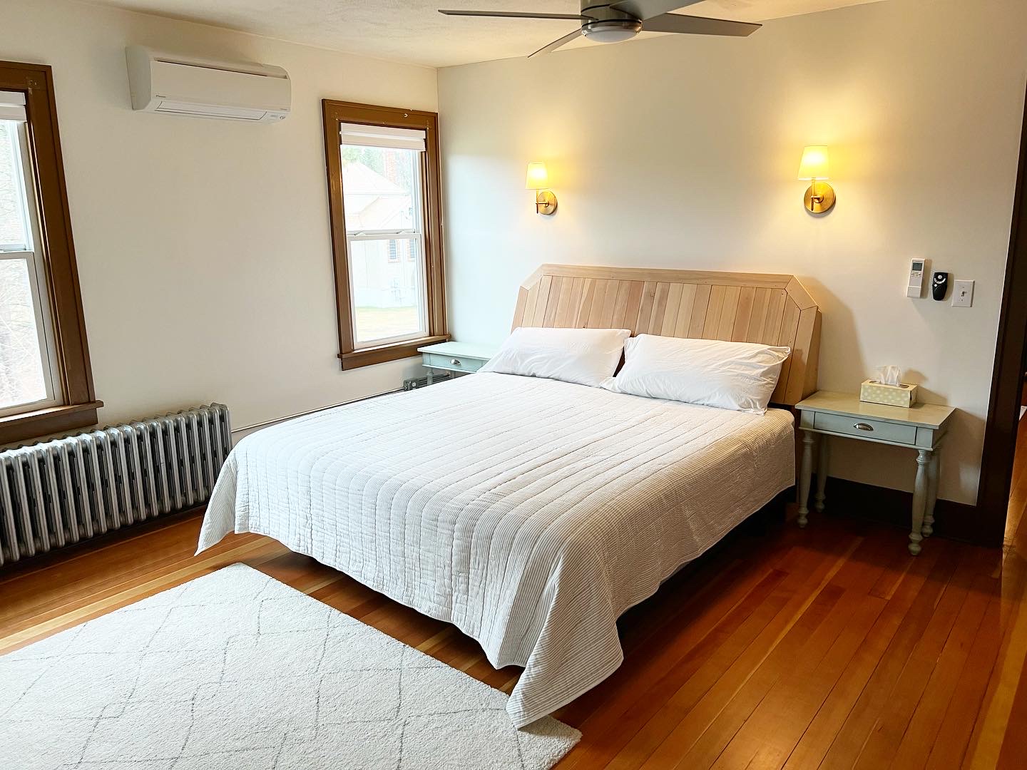 Queen bedroom with wood headboard