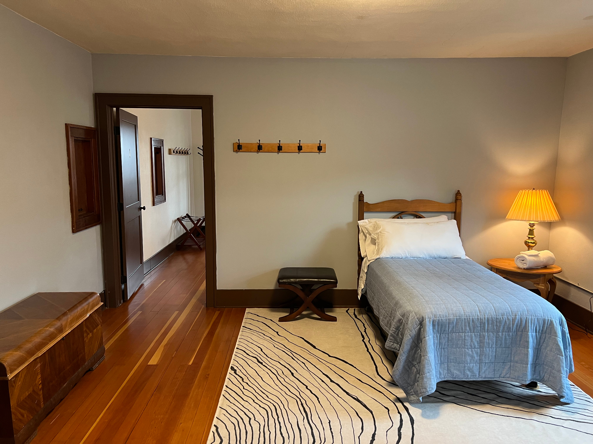 Single bedroom with wood furniture