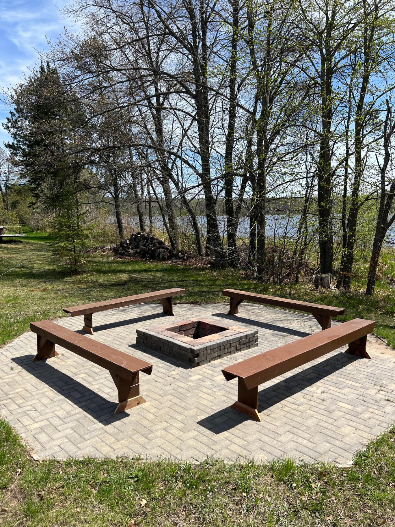 Large brick firepit with bench seating