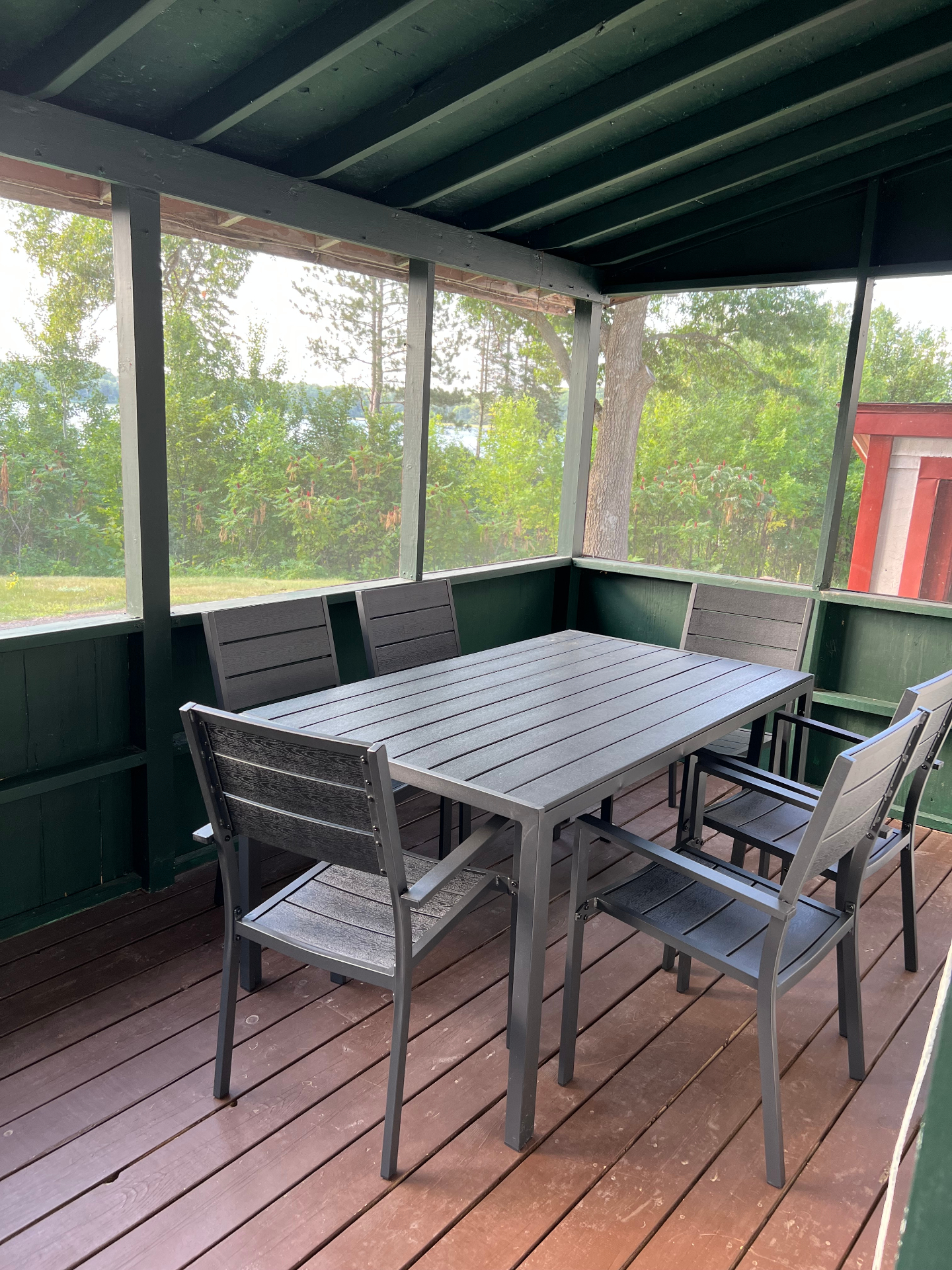 Screened back porch with seating